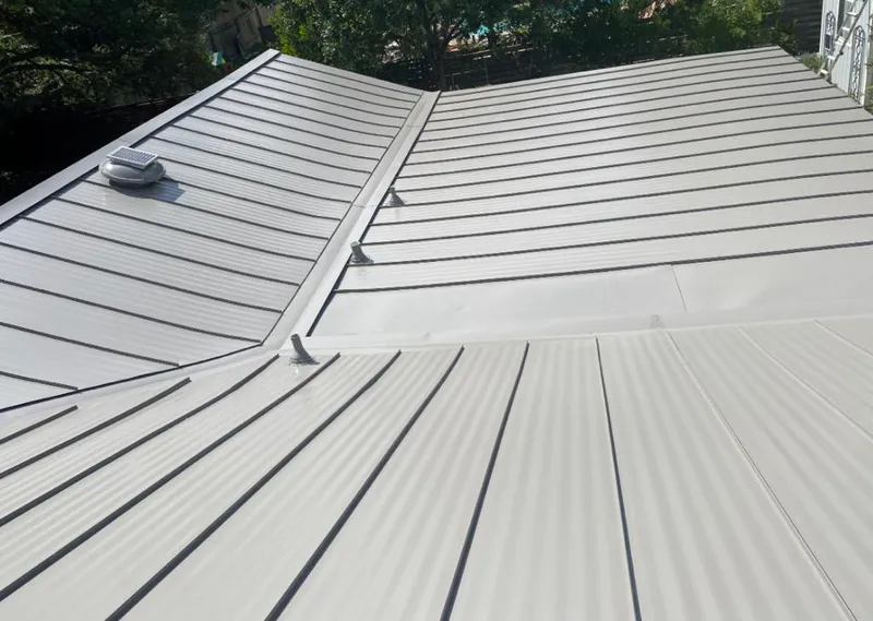 Solar attic fan installed on a metal roof for Roof Ventilation in Hazle